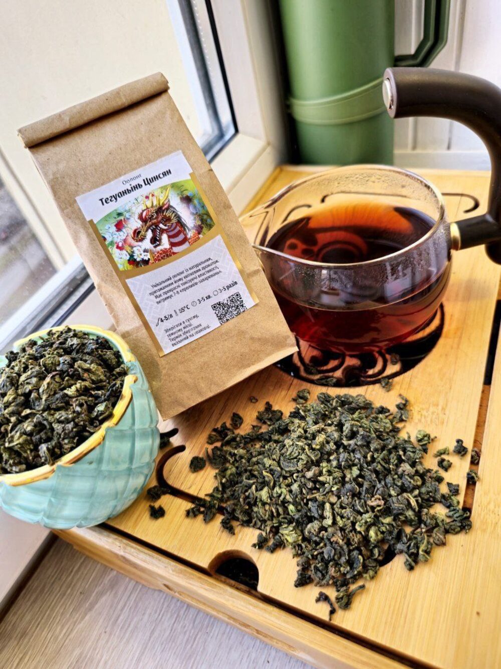 Loose-leaf tea, a brewed cup and packaging from the MyTeaShop online store